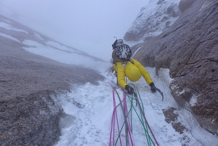 Kyzyl Asker, Luka Lindič, Ines Papert - Ines Papert endures the spindrift during the first ascent of 'Lost in China', SE Face of Kyzyl Asker (5842m), Kyrgyzstan (Luka Lindič, Ines Papert 30/09-01/10/2016)