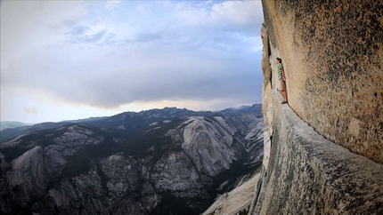 Alex Honnold - Alex Honnold on the Thank God Ledge, high up on the Regular Northwest Face route on Half Dome, Yosemite