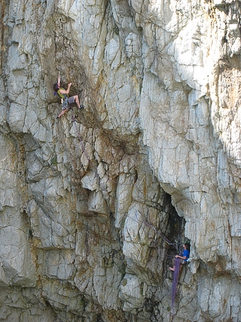 Gogarth, Wales - Gogarth: Nicolas Favresse pulling through the steepness on the final pitch of The Mad Brown E7