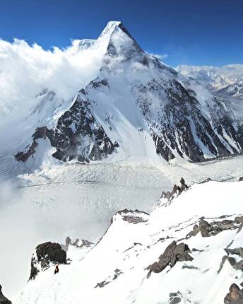 K2  - Tommaso Lamantia heading up to Camp 2 on K2, Broad Peak in the background, July 2024