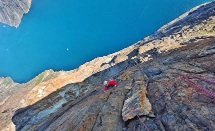 Torsukattak Fjord, Greenland, Miška Izakovičová, Callum Johnson, Tim Miller, Simon Smith - Torsukattak Fjord, Greenland: Miška Izakovičová following a sustained pitch on the headwall of Mussels for Tea, Packrafts in the Sea