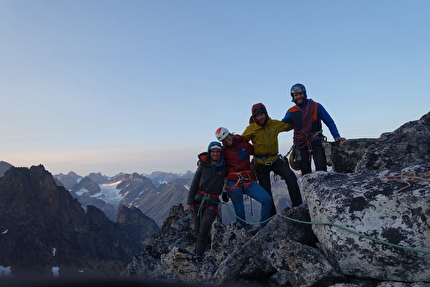 Torsukattak Fjord, Greenland, Miška Izakovičová, Callum Johnson, Tim Miller, Simon Smith - Torsukattak Fjord, Greenland: summit of The Thumbnail after climbing Mussels for Tea, Packrafts in the Sea. Tim Miller, Miška Izakovičová, Simon Smith, Callum Johnson.