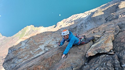 Torsukattak Fjord, Greenland, Miška Izakovičová, Callum Johnson, Tim Miller, Simon Smith - Torsukattak Fjord, Greenland: Tim Miller leading on the headwall of Mussels for Tea, Packrafts in the Sea.