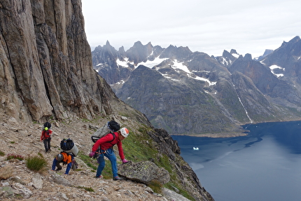 Torsukattak Fjord, Greenland, Miška Izakovičová, Callum Johnson, Tim Miller, Simon Smith - Torsukattak Fjord, Greenland: traversing the scree covered half height ledge with heavy loads